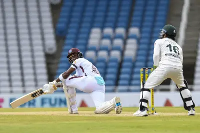 Hodge leads WI's progress on truncated first day