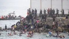 About 60,000 migrants arrive in Ceuta in 24 hours, Spanish territory's leader says